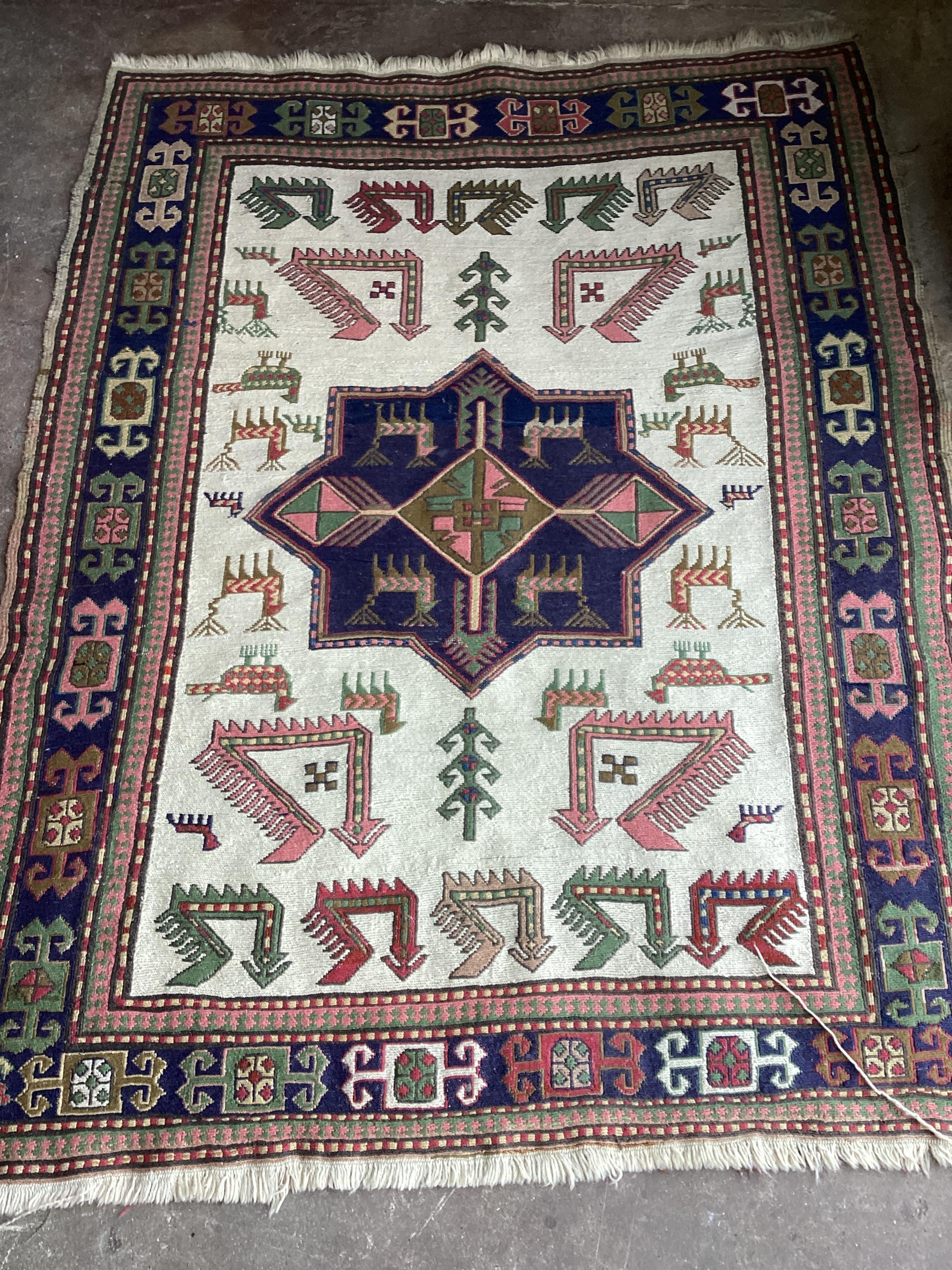 A Caucasian ivory ground rug, 160 x 122cm